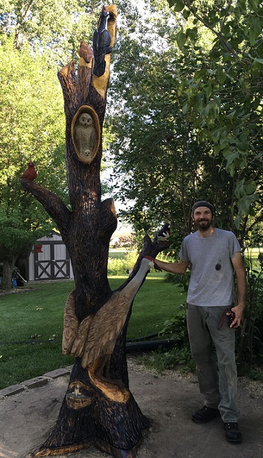 Picture of a carved collection of birds in a tree