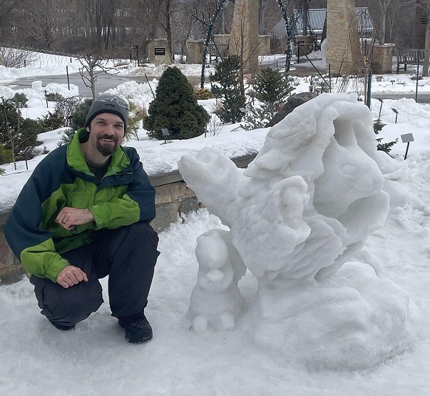 Picture of a carved dragon coming out of a tree