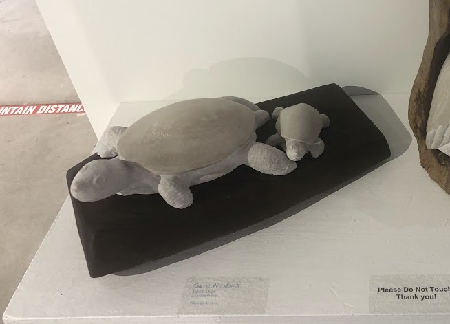 Picture of a carved turtle family in stone