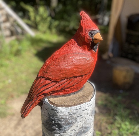 Picture of carved cardinal on a birch branch